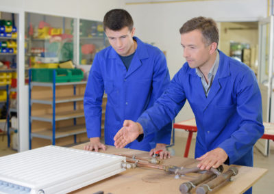 Men repairing a heater