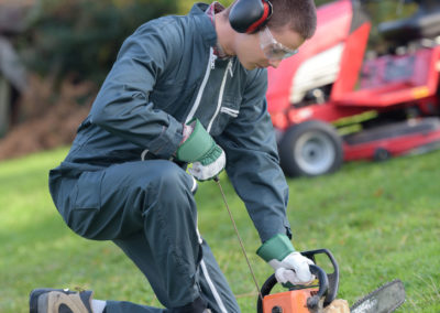 Student turning on a chainsaw