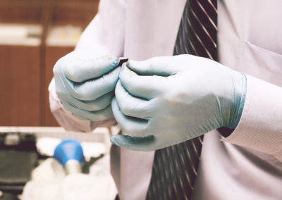 Investigator takes fingerprints from the suspect in the crime.